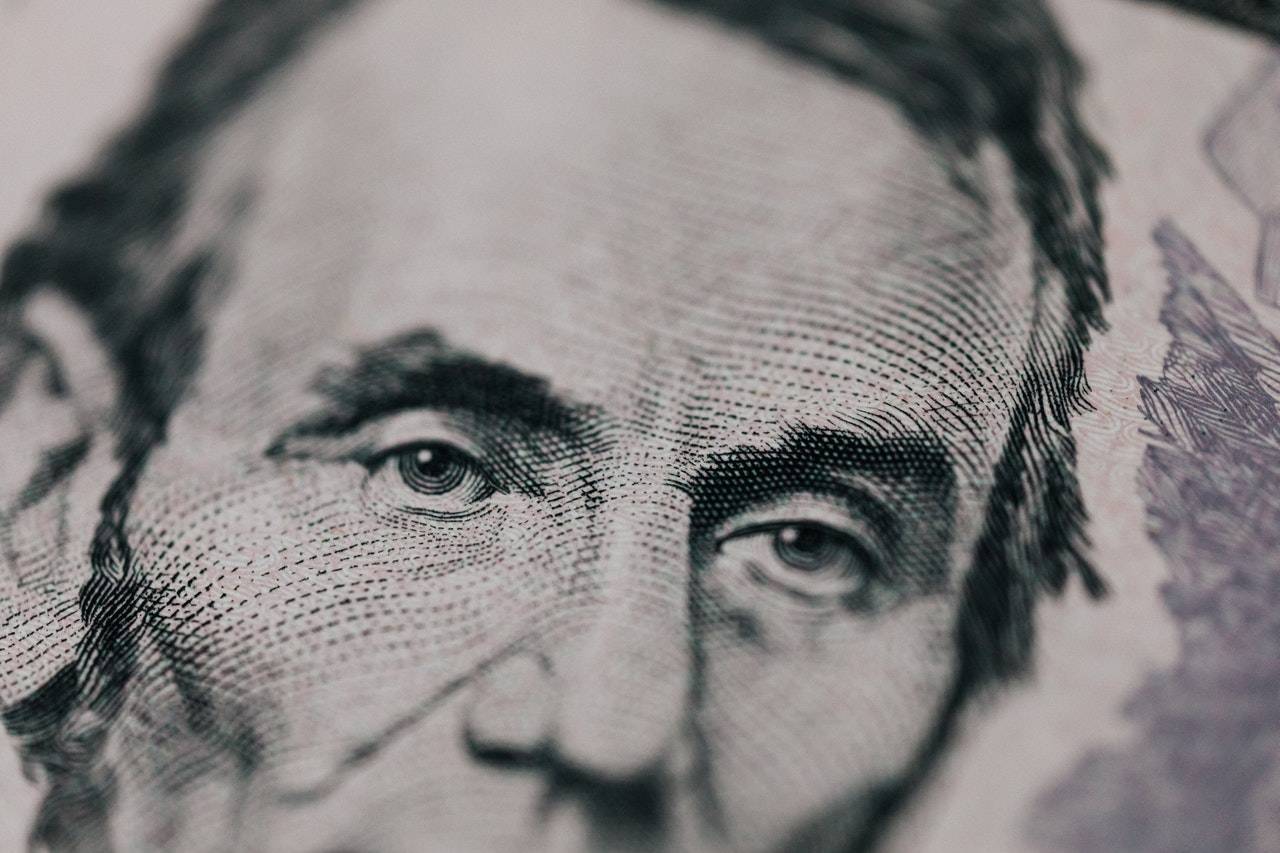 a close-up portrait of a dollar bill - GIBXSWAP